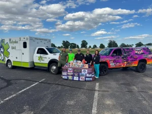 kids first donation to melissa memorial hospital with trucks