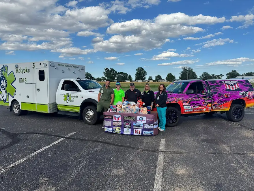 kids first donation to melissa memorial hospital with trucks